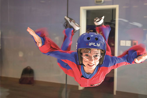 A person enjoying an indoor flying experience