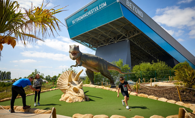 Family playing on a T-Rex course
